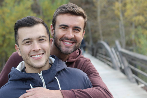 Gay couple enjoying the park in autumn - Zdjęcie, obraz
