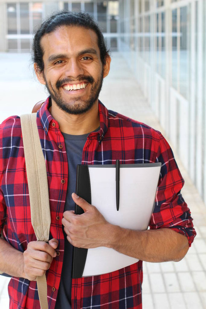 close-up portrait of handsome young mixed race student in red plaid shirt on street - Photo, Image