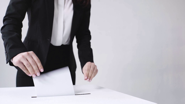 selective focus of businesswoman voting on white - Кадры, видео