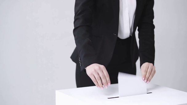 cropped view of businesswoman voting on white - Záběry, video