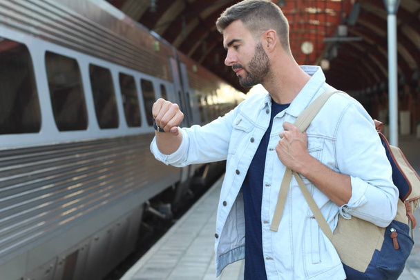 close-up portrait of handsome young man in casual clothes on train station - Φωτογραφία, εικόνα