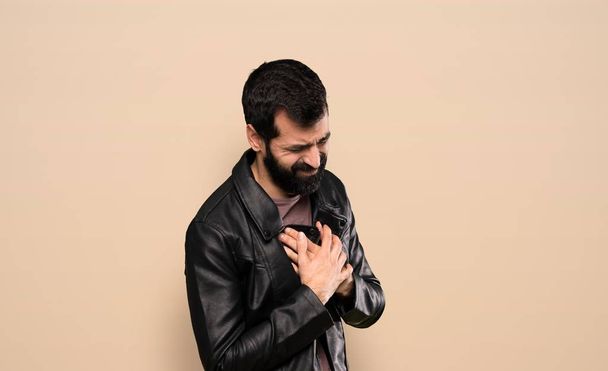 Handsome man with beard having a pain in the heart - Fotografie, Obrázek