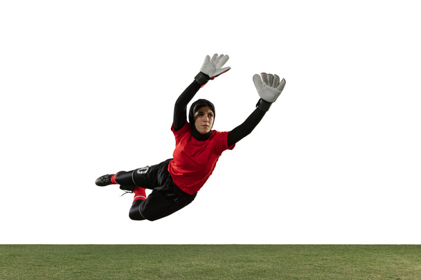 Arabian female soccer or football player, goalkeeper on white studio background - Foto, Bild