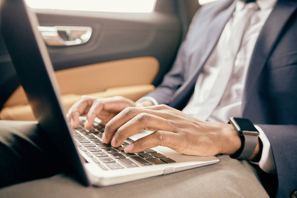 Close up of a businessman typing on the laptop. - Photo, Image