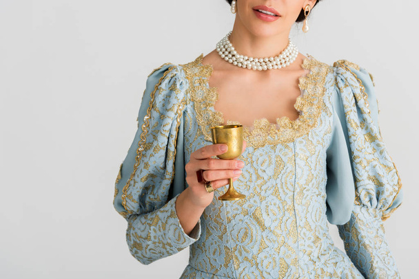 cropped view of queen holding cup isolated on grey - 写真・画像