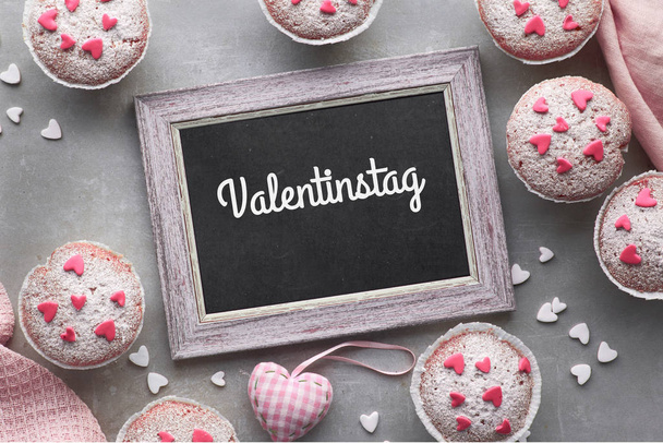 Top view, text "Valentinstag" on blackboard in German means "Val - Photo, Image