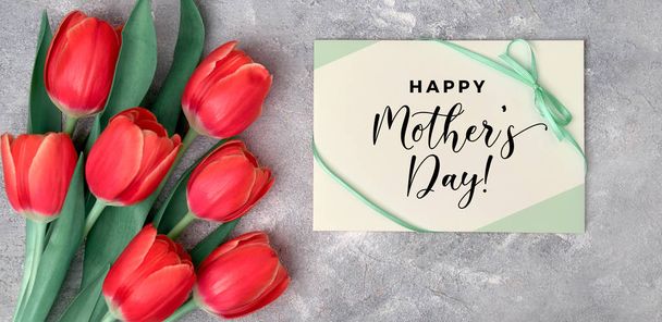 Happy Mother's day, flat lay with red tulips and paper card on g - Foto, Imagem