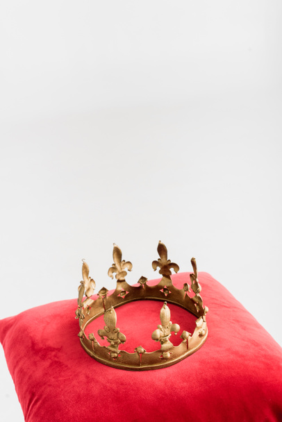 royal crown on red pillow isolated on white - Фото, зображення