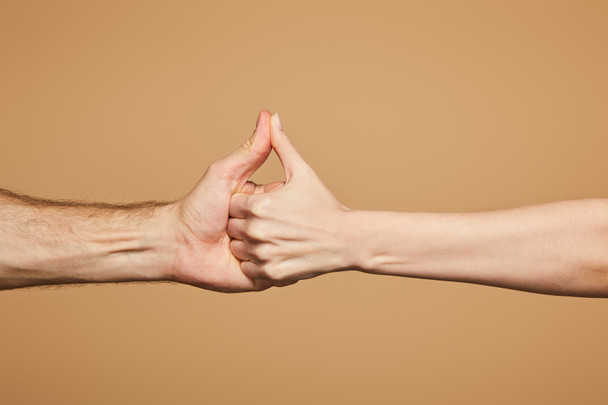 cropped view of man and woman holding hands isolated on beige - Photo, Image