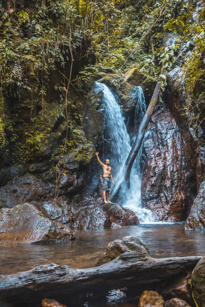 man in Waterfall of the Cerro Azul Meambar National Park (Panacam), Yojoa Lake, Honduras - Fotoğraf, Görsel