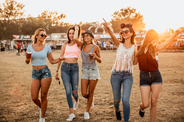 young and pretty women celebrating annual summer music and arts festival - Photo, Image