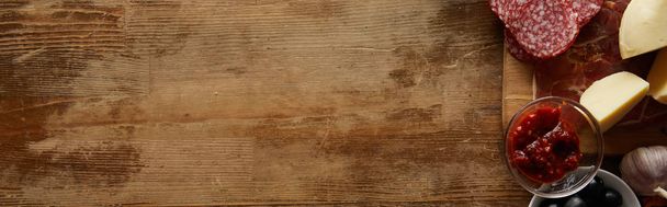 Top view of ingredients for pizza aside on wooden background, panoramic shot - Photo, Image