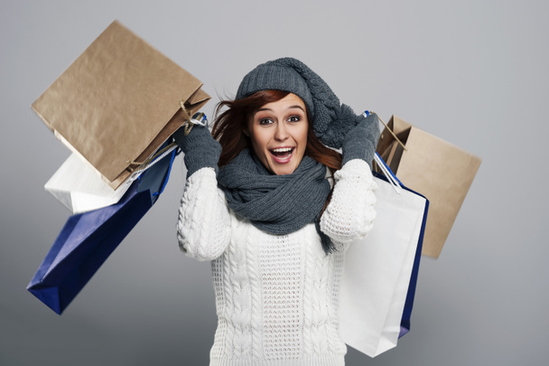 Excited woman during the winter sale - Φωτογραφία, εικόνα