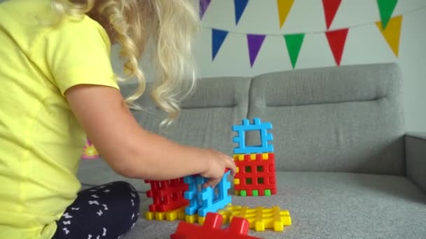Creative girl playing game with constructor pieces parts. Gimbal movement - Video