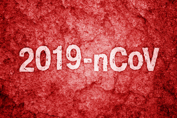 Надпись 2019-nCoV на красной грубой стене
 - Фото, изображение
