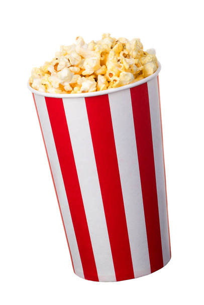 Paper striped bucket with popcorn isolated on white background - Fotó, kép