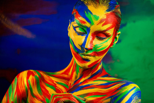 Art fashion makeup. Color face of woman for inspiration. Abstract portrait of the bright beautiful girl with colorful make-up and bodyart. - Fotoğraf, Görsel