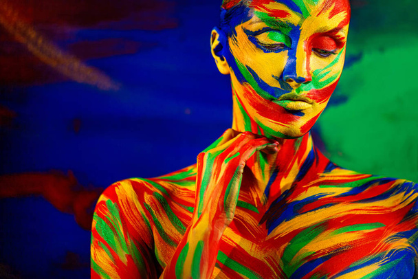 Color art face of woman for inspiration. Abstract portrait of the bright beautiful girl with colorful make-up and bodyart. - Foto, immagini