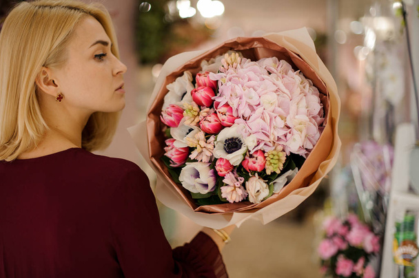 Happy woman holding bouquet with poppies and peonies - Zdjęcie, obraz