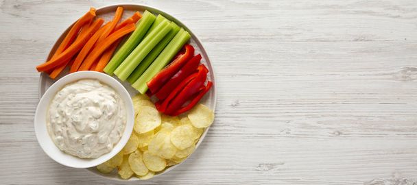 Homemade Caramelized Onion Dip with Potato Chips, Celery, Pepper - Фото, зображення