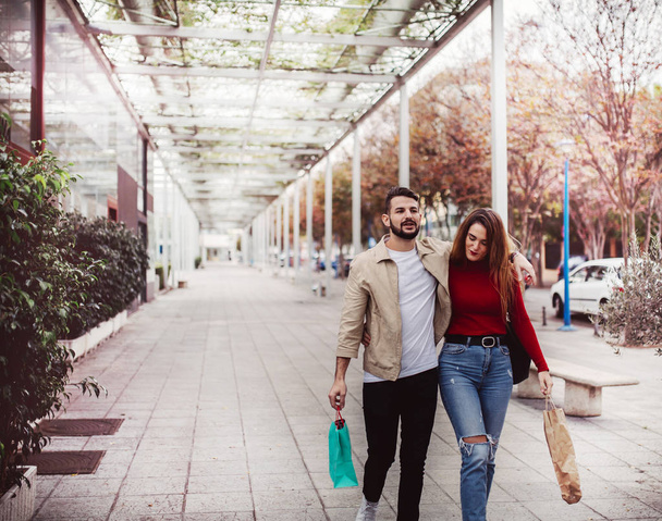 couple in love shopping on the street, lifestyle concept - Photo, Image
