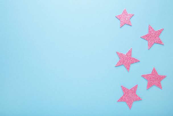 Pink glittering star on pink background, top view - Foto, Imagen