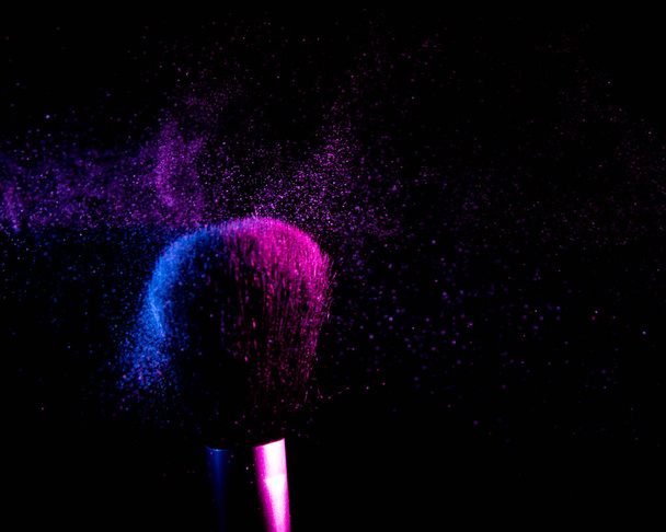 flying shadows from colliding makeup brushes - Foto, Bild
