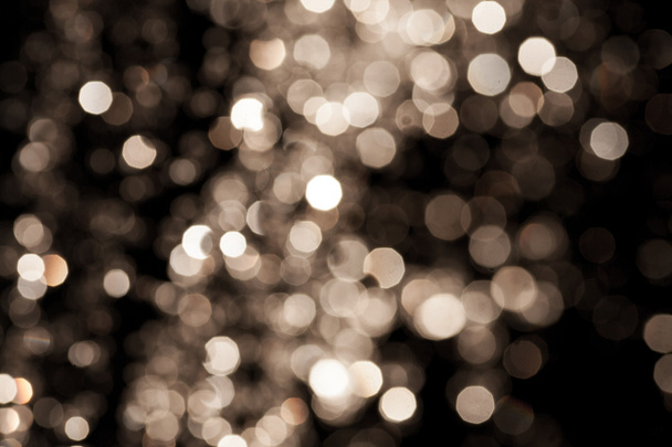 Gold Festive Christmas background. Elegant abstract background with bokeh defocused lights and stars - Foto, immagini