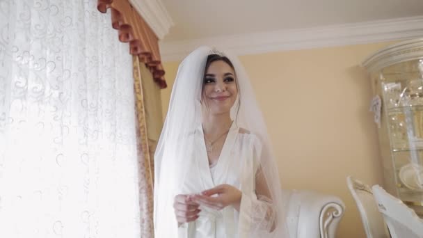 Beautiful and lovely bride in night gown and veil. Wedding morning. Slow motion - Footage, Video