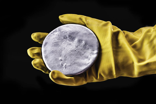 A highly enriched uranium billet. Highly radioactive material used in nuclear research, risk of political crisis. Nuclear weapon, danger of nuclear war. - Photo, Image