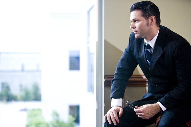 Businessman looking out window - Photo, Image