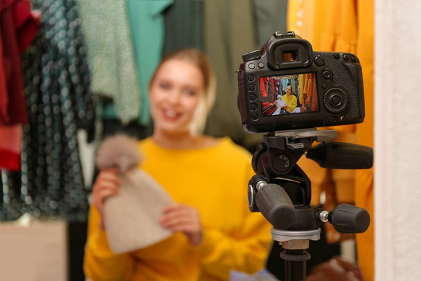 Fashion blogger recording new video in wardrobe, focus on camera - Zdjęcie, obraz