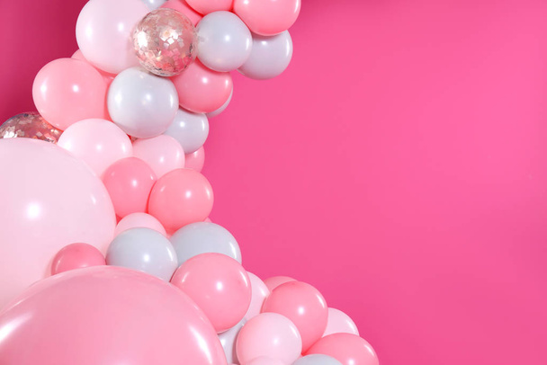 Beautiful composition with balloons on pink background. Space for text - Foto, afbeelding