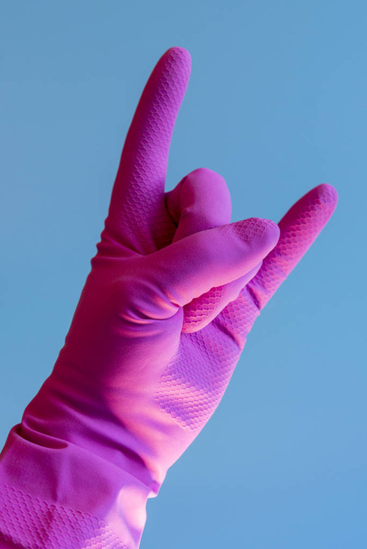 Hand with cleaning glove making gesture.  - Photo, Image