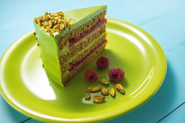 Cake with fruity cream and pistachio decorated with nuts, isolated - Photo, Image