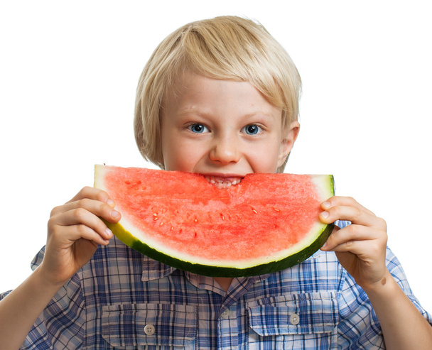 Young boy taking bite of water melon - Fotoğraf, Görsel