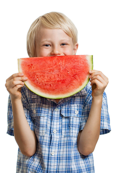 Cute boy peeking behind water melon - Zdjęcie, obraz