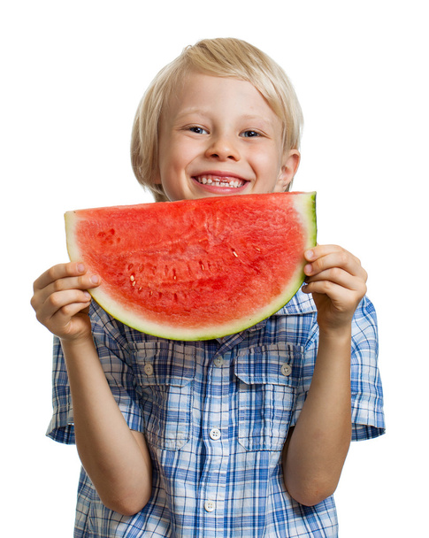 Happy boy laughing behind water melon - 写真・画像