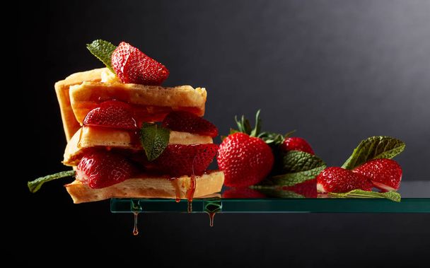 Waffles with strawberries and honey. - Photo, Image