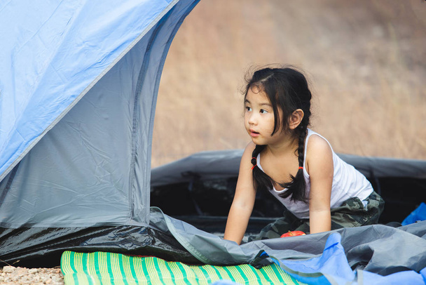 asian little girls alone playing in tent camping travel. - Photo, Image