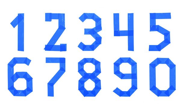 Σύνολο αριθμών από μπλε ταινία Scotch που απομονώνονται σε λευκό φόντο - Φωτογραφία, εικόνα