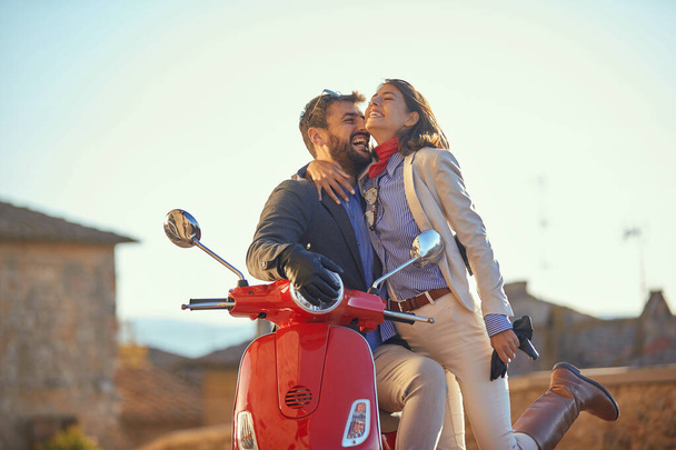 Romantic man and woman with motorcycle. Man and woman riding on  - Foto, Imagem