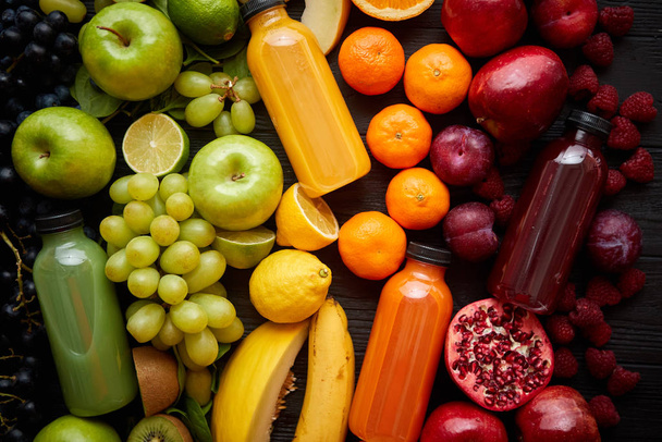 Healthy food concept. Various mixed fruits, vegetables and juices formed in rainbow - 写真・画像