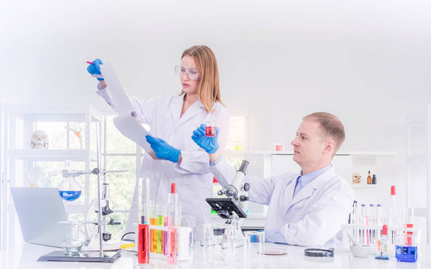 Two scientists working in chemical laboratory - Фото, зображення