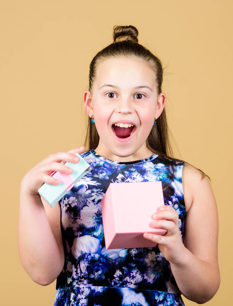 Boxing day. Christmas shopping. Happy birthday. Holiday celebration. Small girl with present box. Surprise. Childrens day. Congratulation. Cheerful child. Little girl with gift. Little shopaholic - Fotó, kép