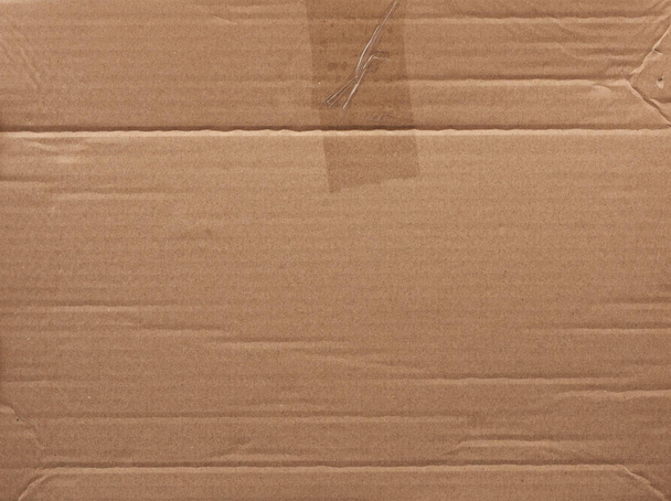 шматок гладкого коричневого картонного паперу, повна рамка
 - Фото, зображення