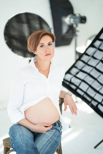 Pregnant Woman Poses For Photo Shoot In Studio - Photo, Image