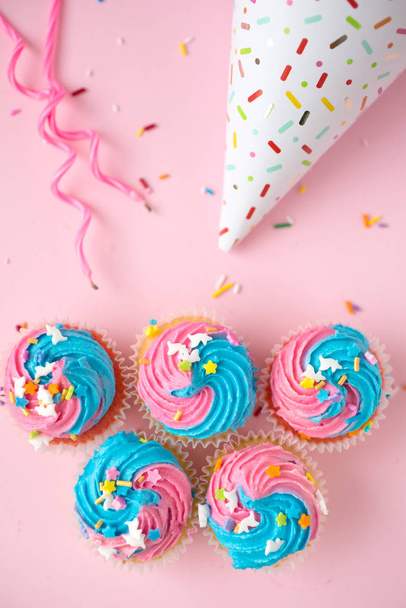 Top view of birthday cupcakes on a pink background - Foto, Imagem