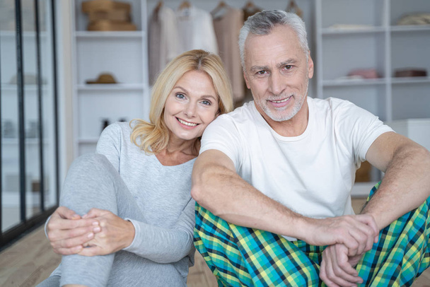 Good looking happy adult couple at home stock photo - Photo, Image