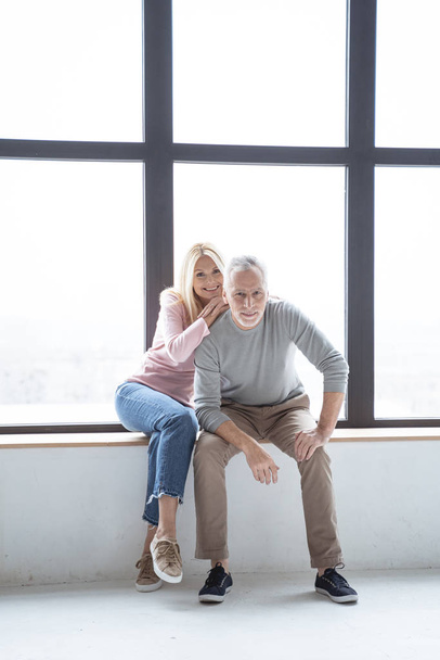 Pretty couple of adults in casual clothes stock photo - Φωτογραφία, εικόνα